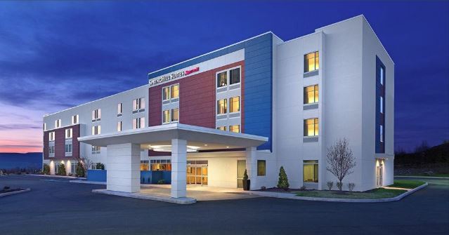 Digital image of a 4-story Springhill Suites by Marriott at twilight